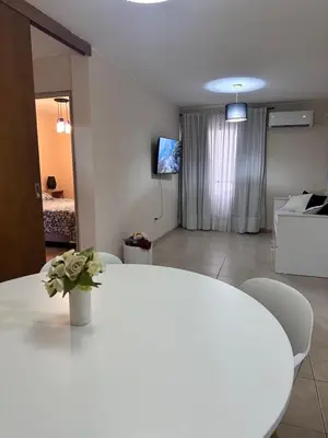 a white table and chairs in a living room at Departamento Premium, Paseo Buen Pastor in Cordoba