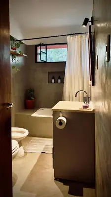 a bathroom with a sink and a tub and a toilet at Anastasia Rústica y acogedora in Cordoba