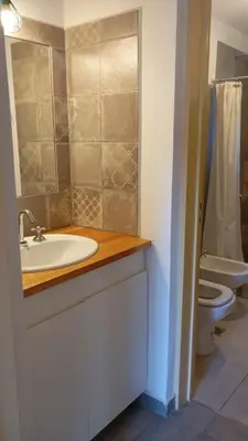 a bathroom with a sink and a toilet at Las Moras in Santa Rosa de Calamuchita