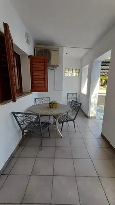 a dining room with a table and two chairs at Los Luises - Departamentos Céntricos in Mina Clavero
