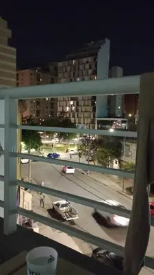 a view from a window of a parking lot at night at TEMPO GÜEMES Departamento en Güemes, casi Nueva Córdoba in Cordoba