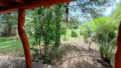 a view of a garden from a porch at Al Pie Del Cerro Champaqui in Los Hornillos