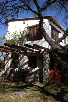 a white house with a tree in front of it at Cielito Lindo in San Javier