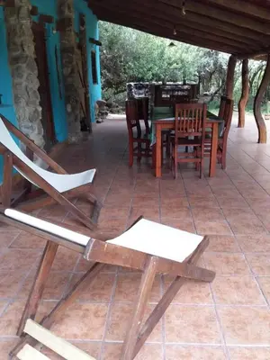 a table and chairs on a patio with a table and chairs at Cielito Lindo in San Javier