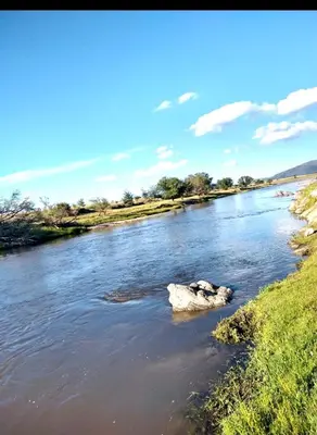 a rock in the middle of a river at Los Laureles de Sorso in Villa Ciudad Parque
