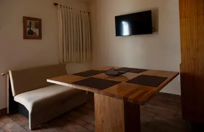 a room with a table with a chess board on it at La Chuklla, alojamiento cerca al lago in Almafuerte