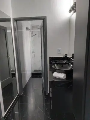 a bathroom with a black sink and a shower at RaGi dpto 3 in Cordoba