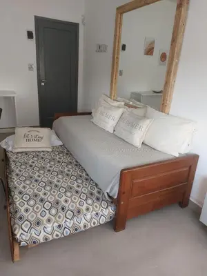 a bed with a large mirror on top of it at RaGi dpto 3 in Cordoba