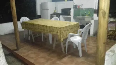 a yellow table and chairs in a kitchen at Posada A Lo De Santys in Villa Independencia