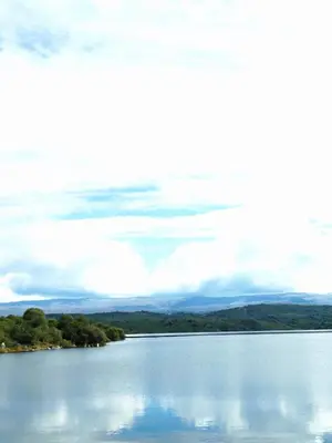 a view of a lake with clouds in the sky at Un lugar en el Mundo in Villa Amancay
