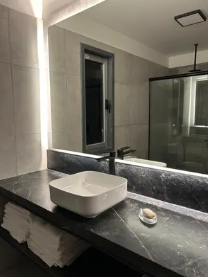 a bathroom with a sink and a large mirror at La cumbrecita ,Casitas super lujo in La Cumbrecita
