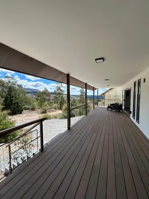 a house with a wooden deck with a view at La cumbrecita ,Casitas super lujo in La Cumbrecita