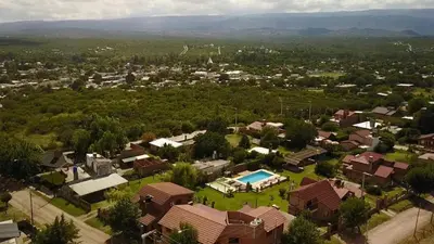 an aerial view of a house with a pool at Altos de Brochero Cabañas & Padel in Villa Cura Brochero