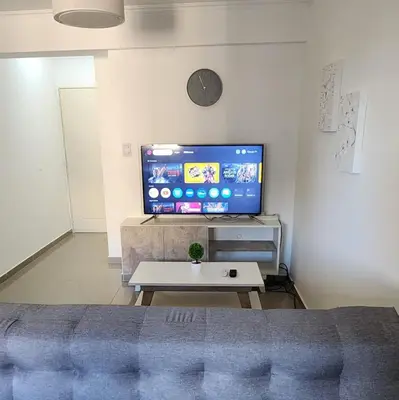 a living room with a tv and a coffee table at Villasol TOP in Cordoba