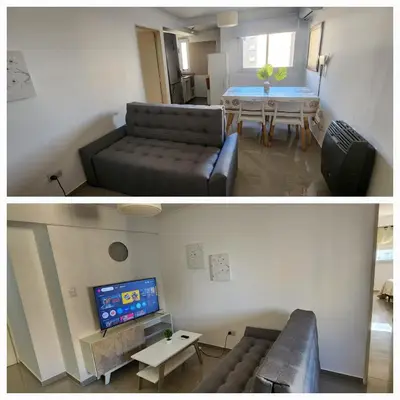 a living room with a couch and a table at Villasol TOP in Cordoba