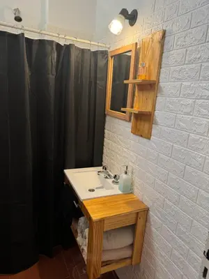 a bathroom with a sink and a mirror at Alma mia in Villa Carlos Paz