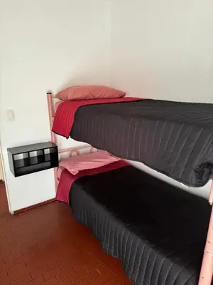 two bunk beds sitting next to each other in a room at Alma mia in Villa Carlos Paz