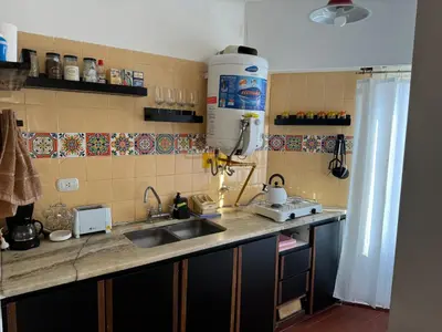 a kitchen with a sink and a counter top at Alma mia in Villa Carlos Paz