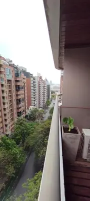 a view of a street from a balcony with a plant at Dpto Eiffel Nueva Córdoba in Cordoba