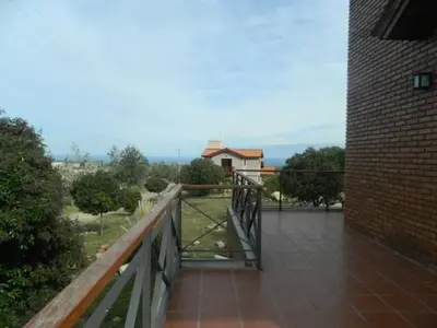 a balcony with a bridge and a brick building at Loszorritos in Merlo