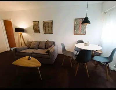 a living room with a couch and a table at Gran Ubicacion Centro in Cordoba