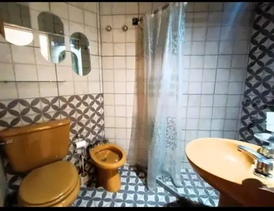 a bathroom with a toilet and a sink and a shower at Gran Ubicacion Centro in Cordoba
