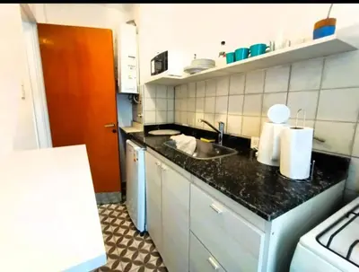 a kitchen with a sink and a counter top at Gran Ubicacion Centro in Cordoba