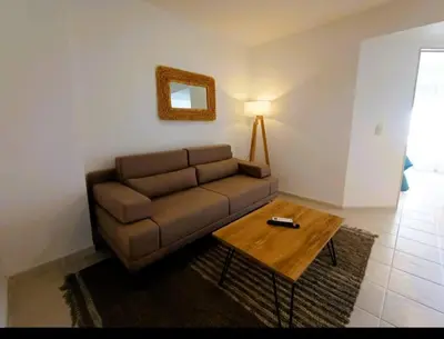 a living room with a couch and a table at Gran Ubicacion Nueva Cordoba in Cordoba