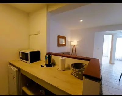 a kitchen with a counter with a microwave on it at Gran Ubicacion Nueva Cordoba in Cordoba