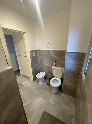 a bathroom with a toilet and a sink at Depto carlos paz in Villa Carlos Paz