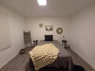 a bedroom with a bed with a blanket on it at Depto carlos paz in Villa Carlos Paz