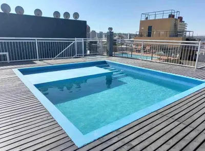 a swimming pool on the roof of a building at Depto carlos paz in Villa Carlos Paz