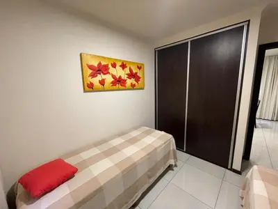 a bedroom with a bed and a painting on the wall at DEPARTAMENTO EN ALQUILER TEMPORAL Ubicado en Villa Carlos Paz in Villa Carlos Paz