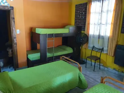 a room with two bunk beds in a room at Paseo por las Nubes in Santa Rosa de Calamuchita