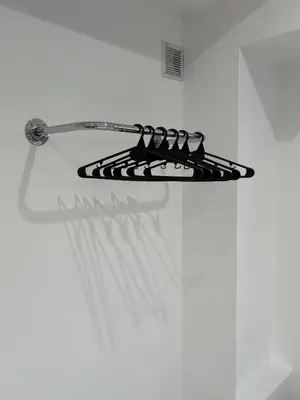 a black stove top in a white room at Luminosos y modernos apartamentos con cochera techada in Cordoba