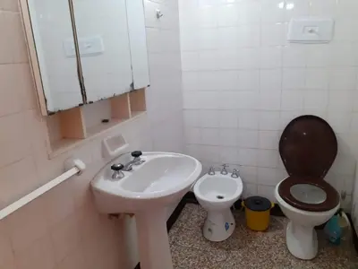 a bathroom with a sink and a toilet at Casa Abuela Tere in Santa Rosa de Calamuchita