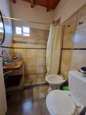 a bathroom with a toilet and a sink at Ventura 2 in Estancia Vieja