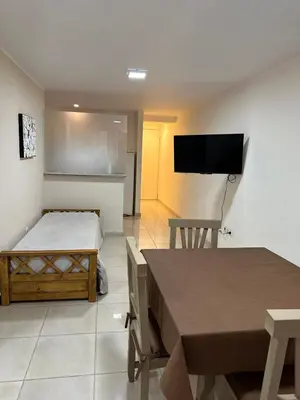 a room with a bed and a flat screen tv at tu lugar 3 in Cordoba