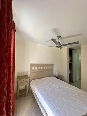 a bedroom with a bed and a ceiling fan at tu lugar 3 in Cordoba