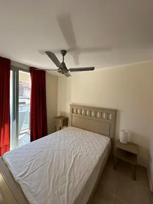 a bedroom with a bed and a ceiling fan at tu lugar 3 in Cordoba