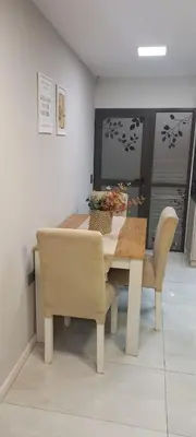a dining room table with chairs and a table and a table and chairsktop at Depto Alta Gracia, 1 cuadra del centro- 75m2 in Alta Gracia