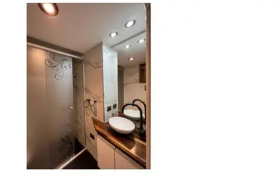 a bathroom with a sink and a mirror at Depto Alta Gracia, 1 cuadra del centro- 75m2 in Alta Gracia
