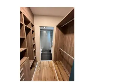 a room with a hallway with wooden floors and shelves at Depto Alta Gracia, 1 cuadra del centro- 75m2 in Alta Gracia