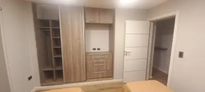 a room with a closet with a wooden cabinet at Depto Alta Gracia, 1 cuadra del centro- 75m2 in Alta Gracia