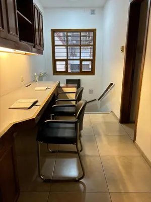 a room with four chairs sitting at a counter at Casa en Nueva Córdoba con Patio y Asador in Cordoba