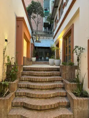 a set of stone stairs in front of a building at Casa en Nueva Córdoba con Patio y Asador in Cordoba