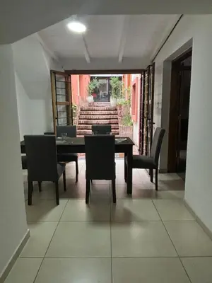 a dining room with a table and chairs at Casa en Nueva Córdoba con Patio y Asador in Cordoba