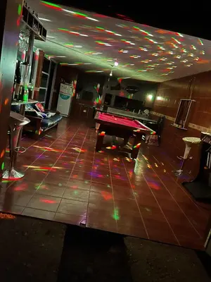 a ping pong table in a gaming room with a ping pong table at La Armonía in Potrero de Garay