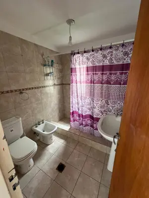 a bathroom with a toilet and a sink at La Armonía in Potrero de Garay