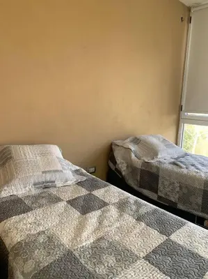 two beds sitting next to each other in a bedroom at Casa Cabalango in Cavalango